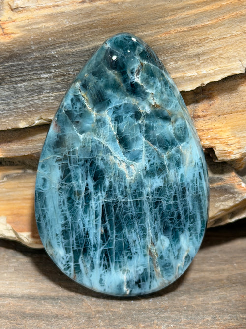 Vivid layers of teal, turquoise and deep blue create striking natural striations across this substantial Blue Apatite cabochon