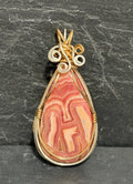 Whimsical Rhodochrosite pendant, two-tone wire wrapped in tarnish-resistant Argentium Silver and 14/20 yellow gold