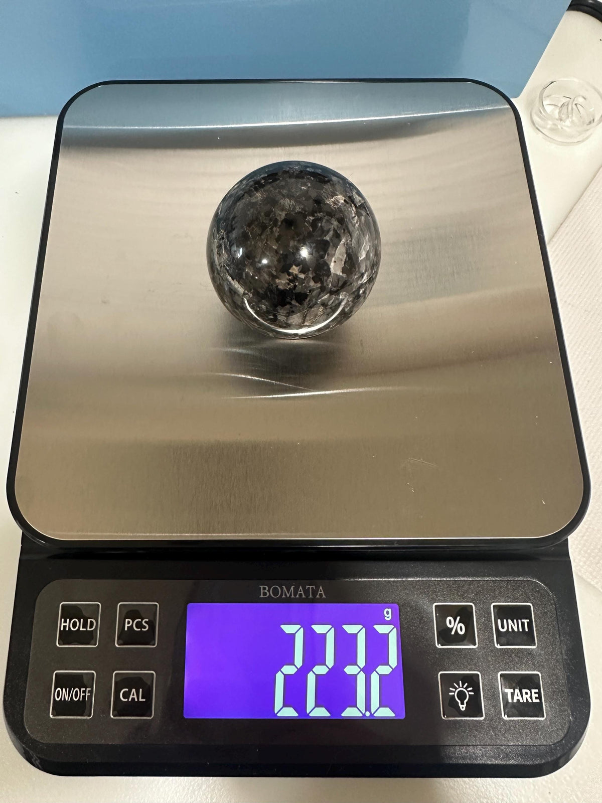 Small polished black crystal sphere mineral specimen for collection, display, decor