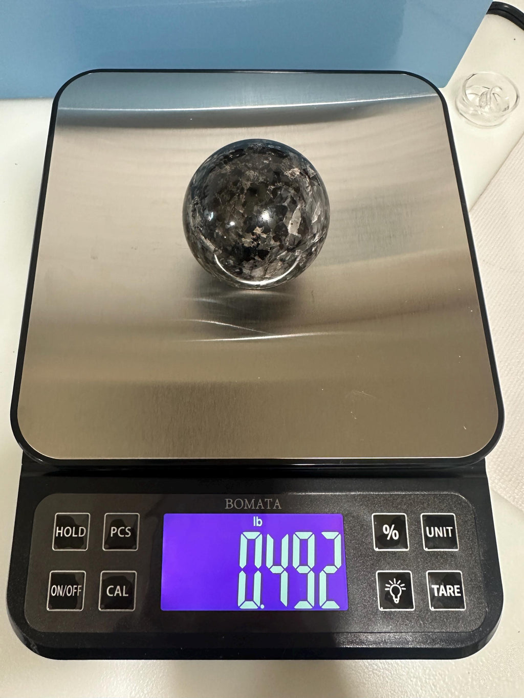 Small polished black crystal sphere mineral specimen for collection, display, decor