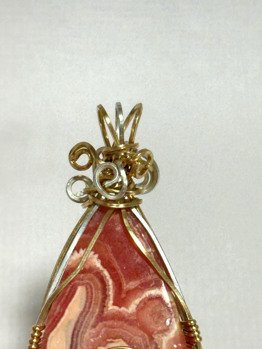 Whimsical Rhodochrosite pendant, two-tone wire wrapped in tarnish-resistant Argentium Silver and 14/20 yellow gold