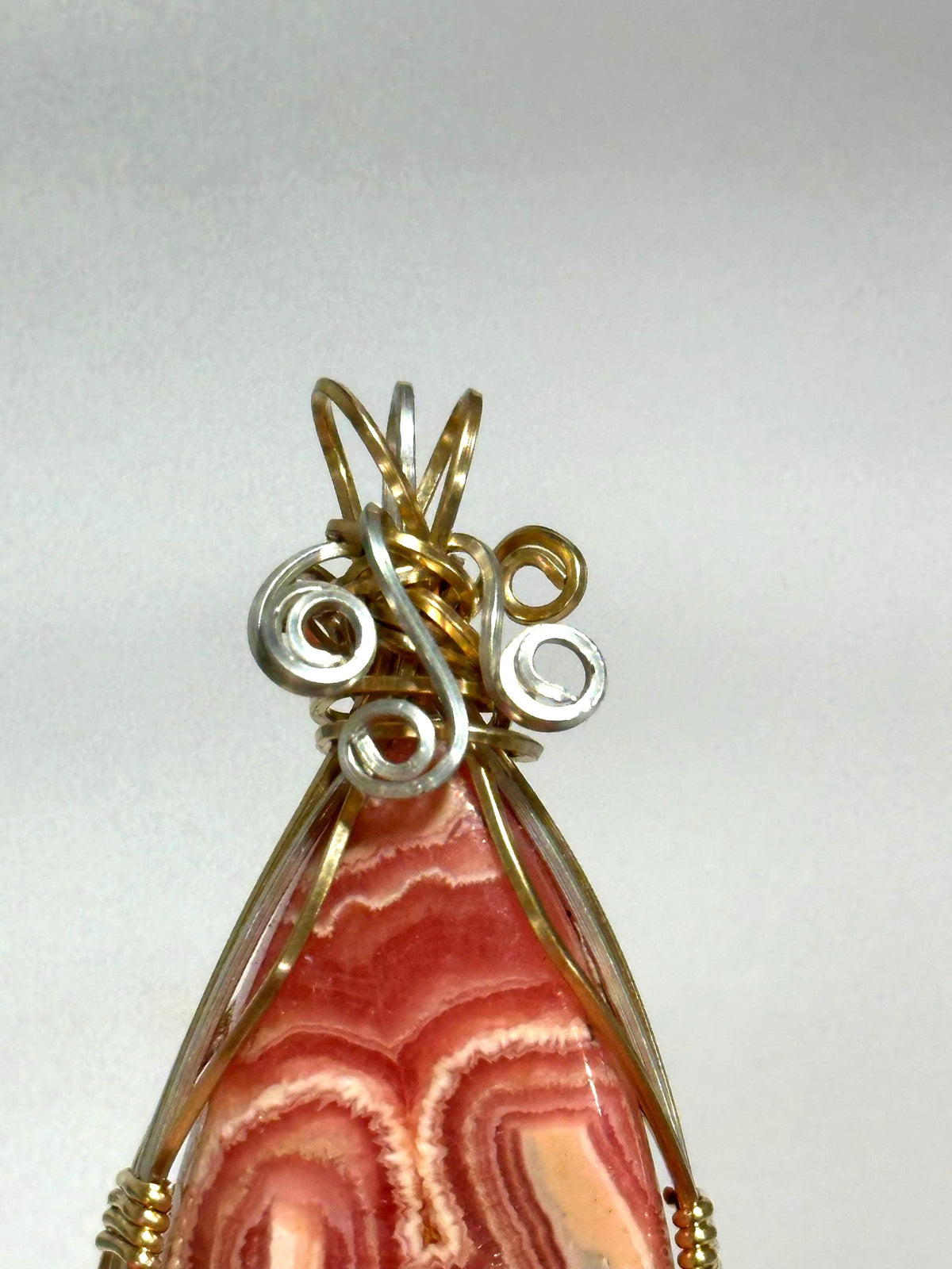 Whimsical Rhodochrosite pendant, two-tone wire wrapped in tarnish-resistant Argentium Silver and 14/20 yellow gold