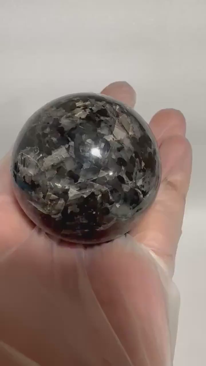 Small polished black crystal sphere mineral specimen for collection, display, decor